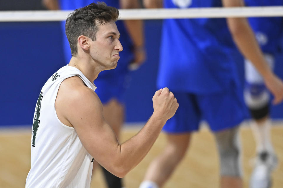 Hawaii's Colton Cowell celebrates after a Hawaii point during the NCAA men's volleyball championship match against BYU, Saturday, May 8, 2021, in Columbus, Ohio. (AP Photo/David Dermer)