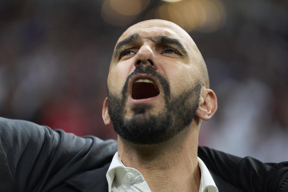 AL KHOR, QATAR - DECEMBER 14: Walid Regragui, head coach of Morocco stands for the national anthem prior to the FIFA World Cup Qatar 2022 semi final match between France and Morocco at Al Bayt Stadium on December 14, 2022 in Al Khor, Qatar. (Photo by Juan Luis Diaz/Quality Sport Images/Getty Images)