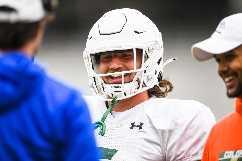 Colorado State's Dallin Holker  smiles during a practice at Canvas Stadium in Fort Collins on Saturday, April 8, 2023.