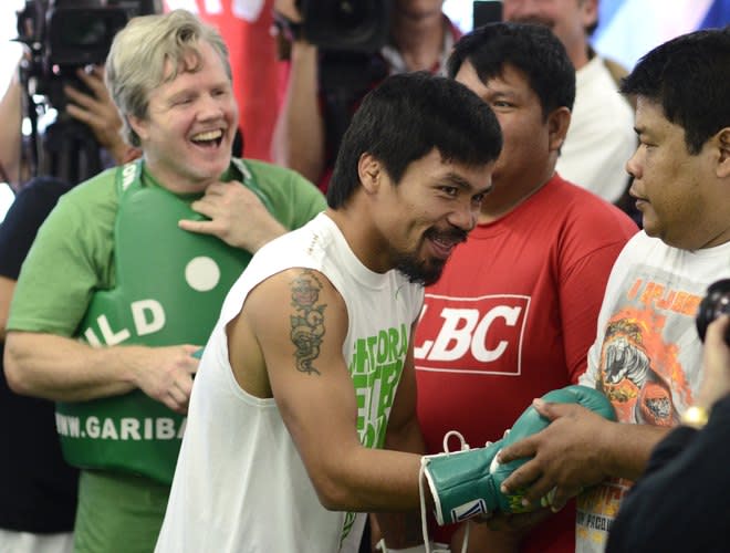 Freddie Roach (L) And Manny Pacquiao (R) Of The Philippinesprepare For A Media Workout At Wild Card Boxing Club On May AFP/Getty Images