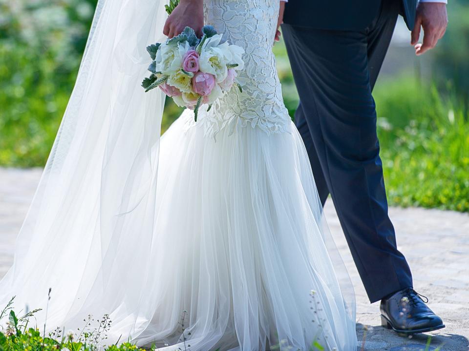 bride and groom walking on wedding day