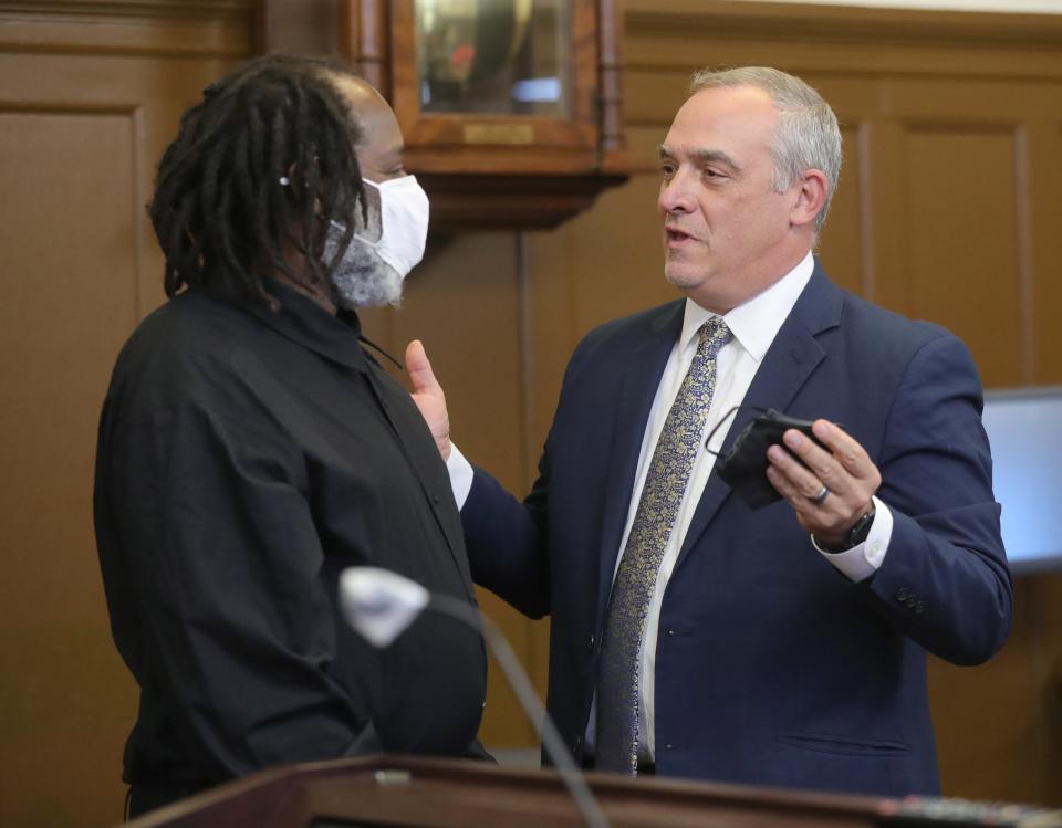 Stanley Ford talks with defense attorney Scott Rilley after a jury recommended in October that he receive a life in prison sentence instead of the death penalty for the arson deaths of nine of his neighbors.