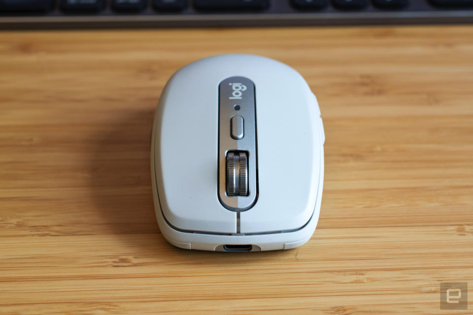 The Logitech MX Anywhere 3 mouse on a wooden table.