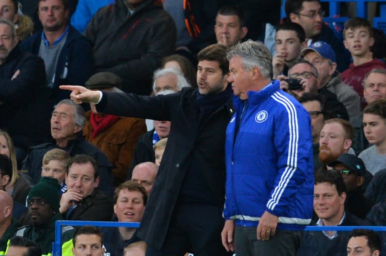 Tottenham Hotspur's head coach Mauricio Pochettino (L) talks with Chelsea's interim manager Guus Hiddink (R) on the touchline during the English Premier League football match at Stamford Bridge in London on May 2, 2016