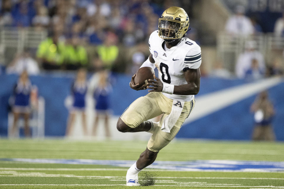 Akron quarterback DJ Irons (0) runs the ball during the first half of an NCAA college football game against Kentucky in Lexington, Ky., Saturday, Sept. 16, 2023. (AP Photo/Michelle Haas Hutchins)