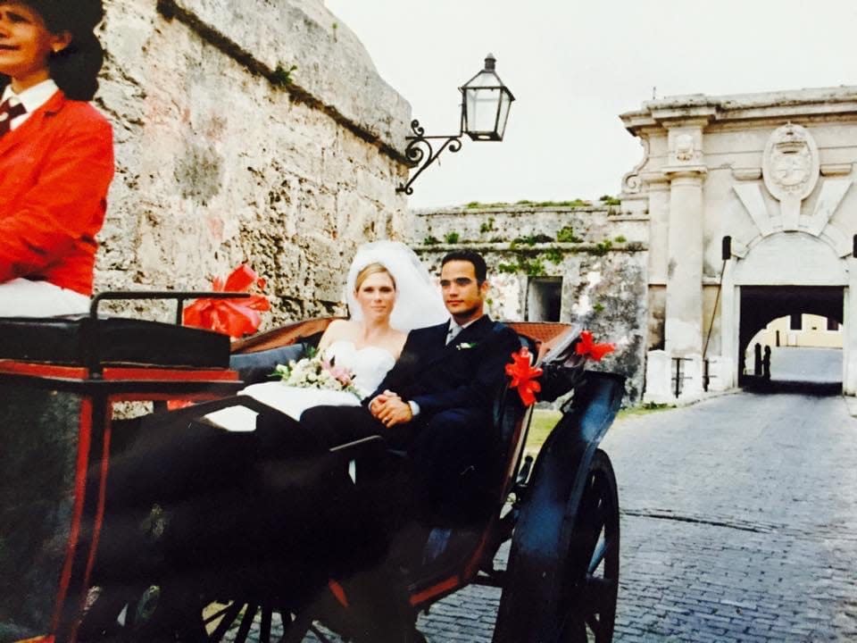 Melanie Bowden Simón and Luis Simón riding in a carriage after getting married in Havana, Cuba, in 2003.