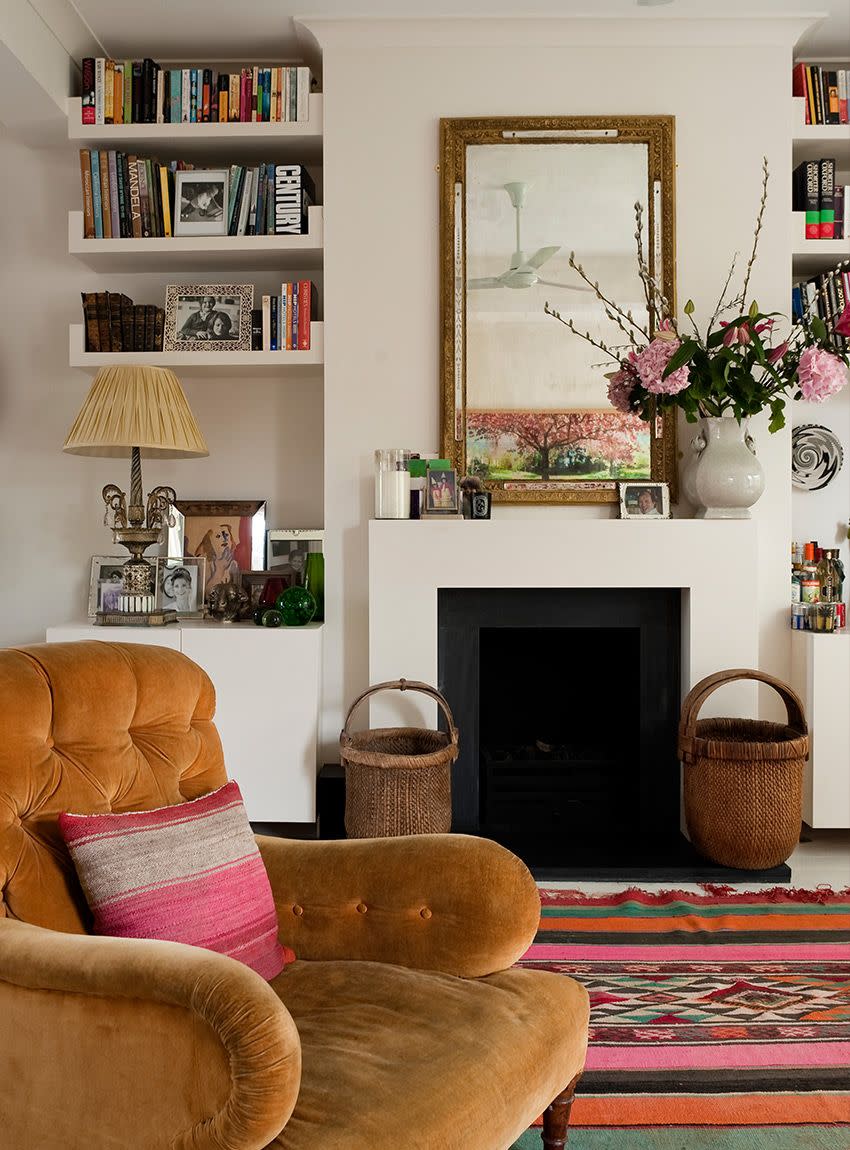 a living room with a fireplace floating bookshelf ideas