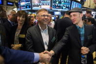 Shopify founder and Chief Executive Officer Tobi Lutke (R) smiles with the company's Chief Financial Officer Russ Jones after the company's IPO on the floor of the New York Stock Exchange May 21, 2015. REUTERS/Lucas Jackson