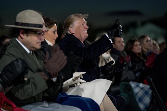 President Donald Trump, accompanied by first lady Melania Trump gives a thumbs up to a performer during the National Christmas Tree lighting ceremony at the Ellipse near the White House in Washington, Wednesday, Nov. 28, 2018. (Photo: Andrew Harnik/AP)