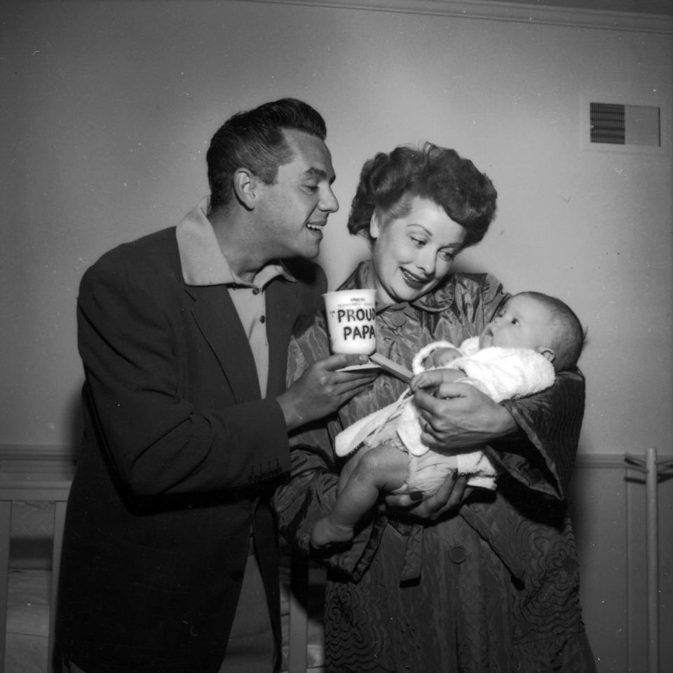 1953: With Desi Sr., proudly holding their newborn son Desi Jr