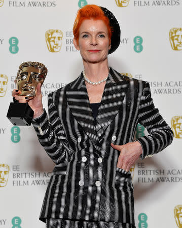 Sandy Powell holds the award for costume design for the film The Favourite at the British Academy of Film and Television Awards (BAFTA) at the Royal Albert Hall in London, Britain, February 10, 2019. REUTERS/Toby Melville