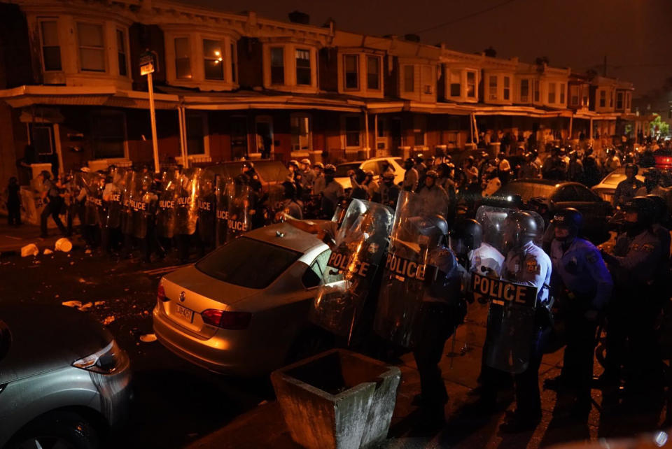 Police officers move in formation during a protest in response to the police shooting of Walter Wallace Jr., Monday, Oct. 26, 2020, in Philadelphia. Police officers fatally shot the 27-year-old Black man during a confrontation Monday afternoon in West Philadelphia that quickly raised tensions in the neighborhood. (Jessica Griffin/The Philadelphia Inquirer via AP)