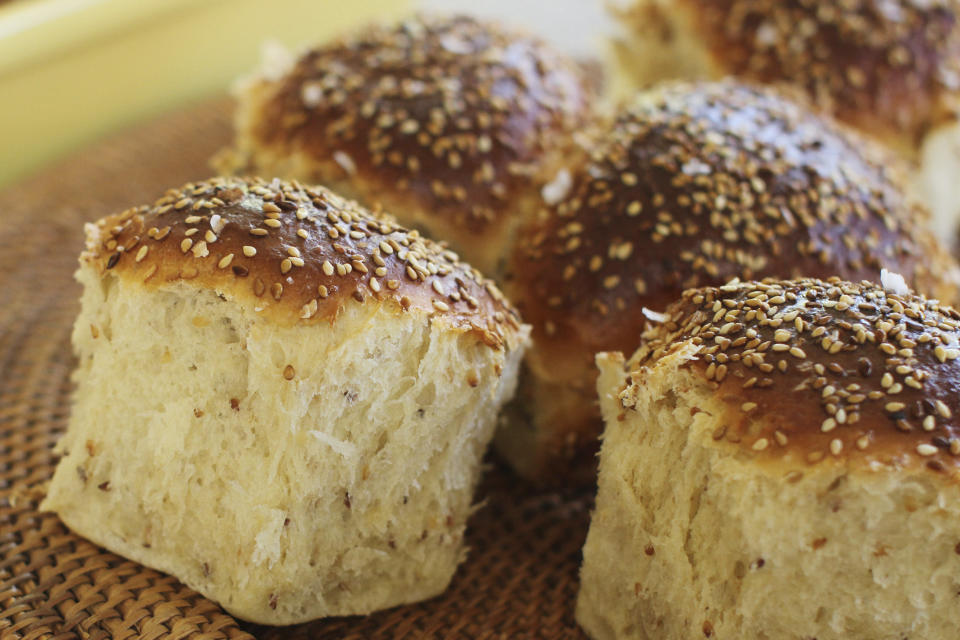 FILE - Sesame dinner rolls sit on a mat in Concord, N.H., on Oct. 12, 2015. Food manufacturers who deliberately add sesame to their products and include it on the labels are not violating a new federal law, the U.S. Food and Drug Administration said Wednesday, July 26, 2023. (AP Photo/Matthew Mead, File)