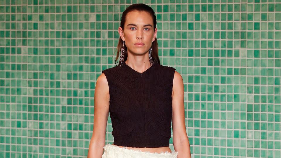 2000s It-girl Alexa Chung made her New York Fashion Week debut at Tory Burch in a skirt with a wide, floating waist that tricked the eye as she moved. - Shutterstock