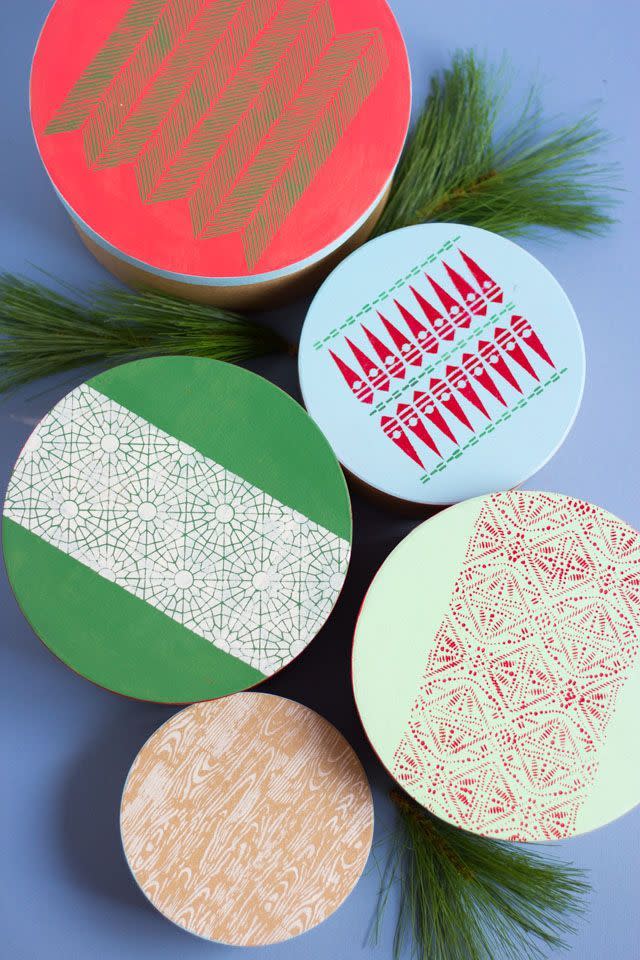 <p>Looking for an idea that's pretty and practical all at once? This is your best bet: These stenciled patterns will spiff up gift boxes, which can then be used for year-round ornament storage.</p><p><strong>Get the tutorial at <a href="https://designimprovised.com/2018/11/how-to-make-stenciled-christmas-gift-boxes.html" rel="nofollow noopener" target="_blank" data-ylk="slk:Design Improvised" class="link rapid-noclick-resp">Design Improvised</a>.</strong></p>