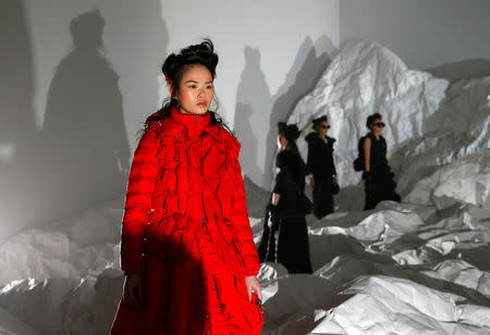 Models present creations from the Moncler Autumn/Winter 2018 women collection during Milan Fashion Week in Milan, Italy February 20, 2018. REUTERS/Tony Gentile TPX IMAGES OF THE DAY