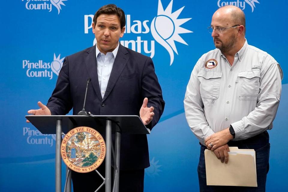 Florida Gov. Ron DeSantis with Kevin Guthrie, director of the Florida Division of Emergency Management, during a news conference on Sept. 26 in Largo.