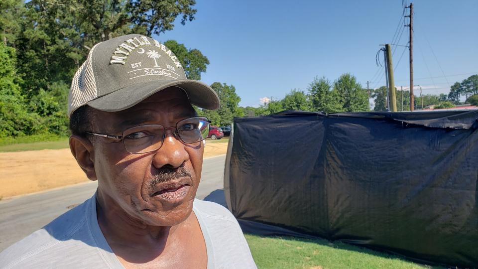 Bobby Hill, a Foxfire resident, stands near a construction site for a gas regulator owned by Piedmont Natural Gas on Monday, July 31, 2023. Hill has opposed the project but says the utility, which is a susidiary of Duke Energy, has been working with neighbors on how the site will look when complete.