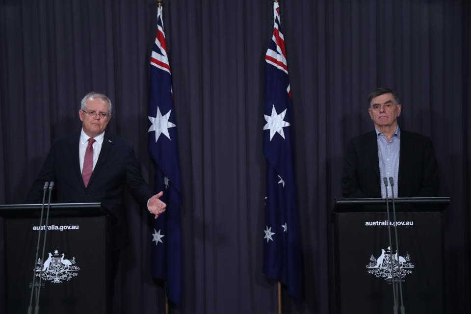 Pictured is Australian Prime Minister Scott Morrison and the Chief Medical Officer Brendan Murphy addressing reporters at Parliament House in Canberra