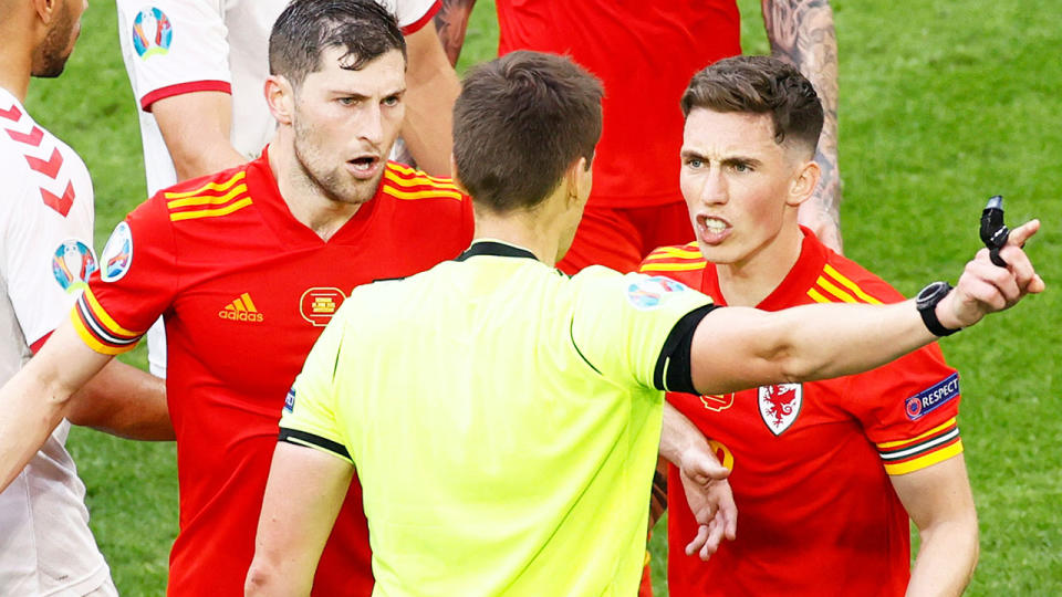 Harry Wilson, pictured here arguing with the referee after being sent off against Denmark.