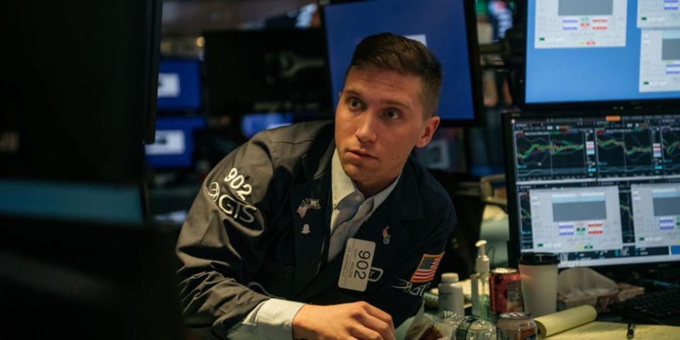 Traders work on the floor of the New York Stock Exchange