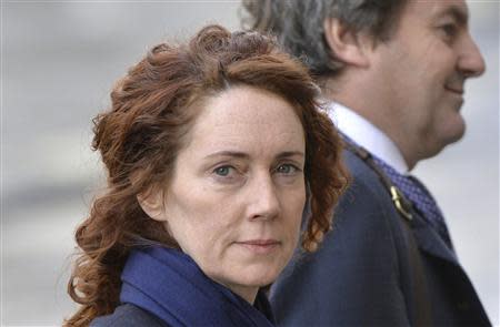 Former News International chief executive Rebekah Brooks arrives with her husband Charlie at the Old Bailey courthouse in London February 27, 2014. REUTERS/Toby Melville