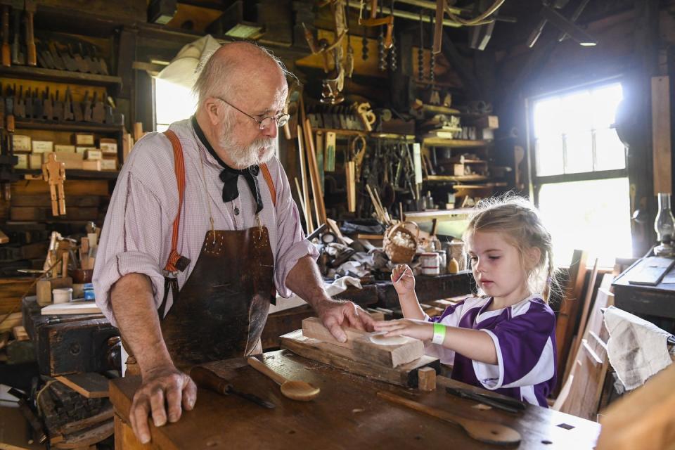 a man and child woodworking