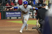 Chicago Cubs' Nico Hoerner scores on a wild pitch against the Arizona Diamondbacks during the ninth inning of a baseball game, Monday, April 15, 2024, in Phoenix. (AP Photo/Matt York)