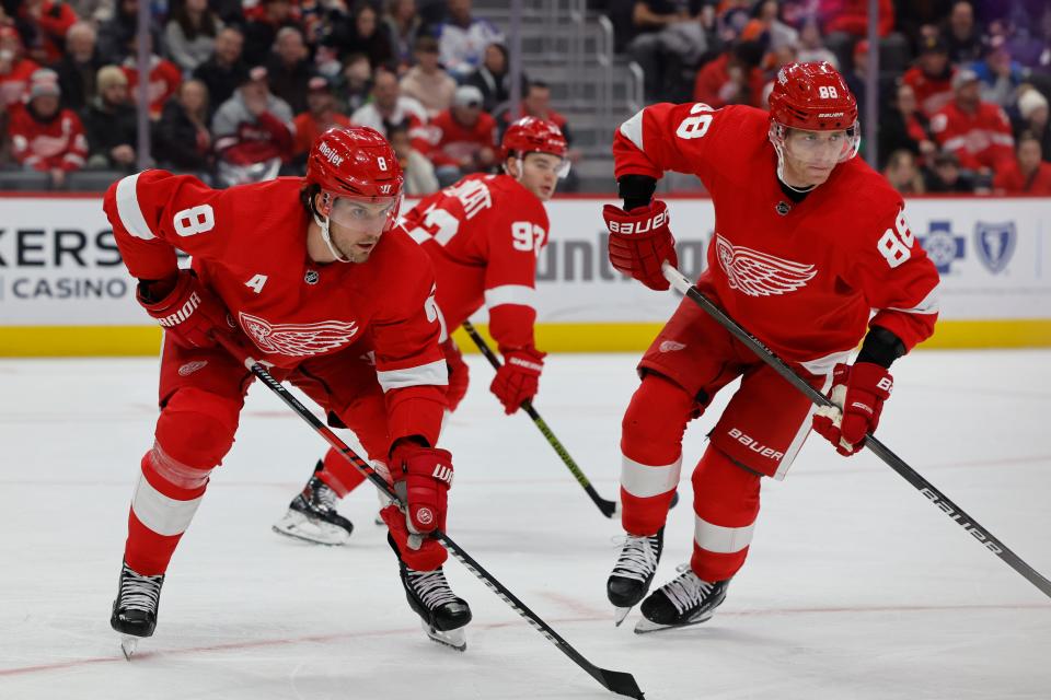 Detroit Red Wings defenseman Ben Chiarot (8) and right wing Patrick Kane (88) gets set during face off in the first period at Little Caesars Arena in Detroit on Thursday, Jan. 11, 2024.
