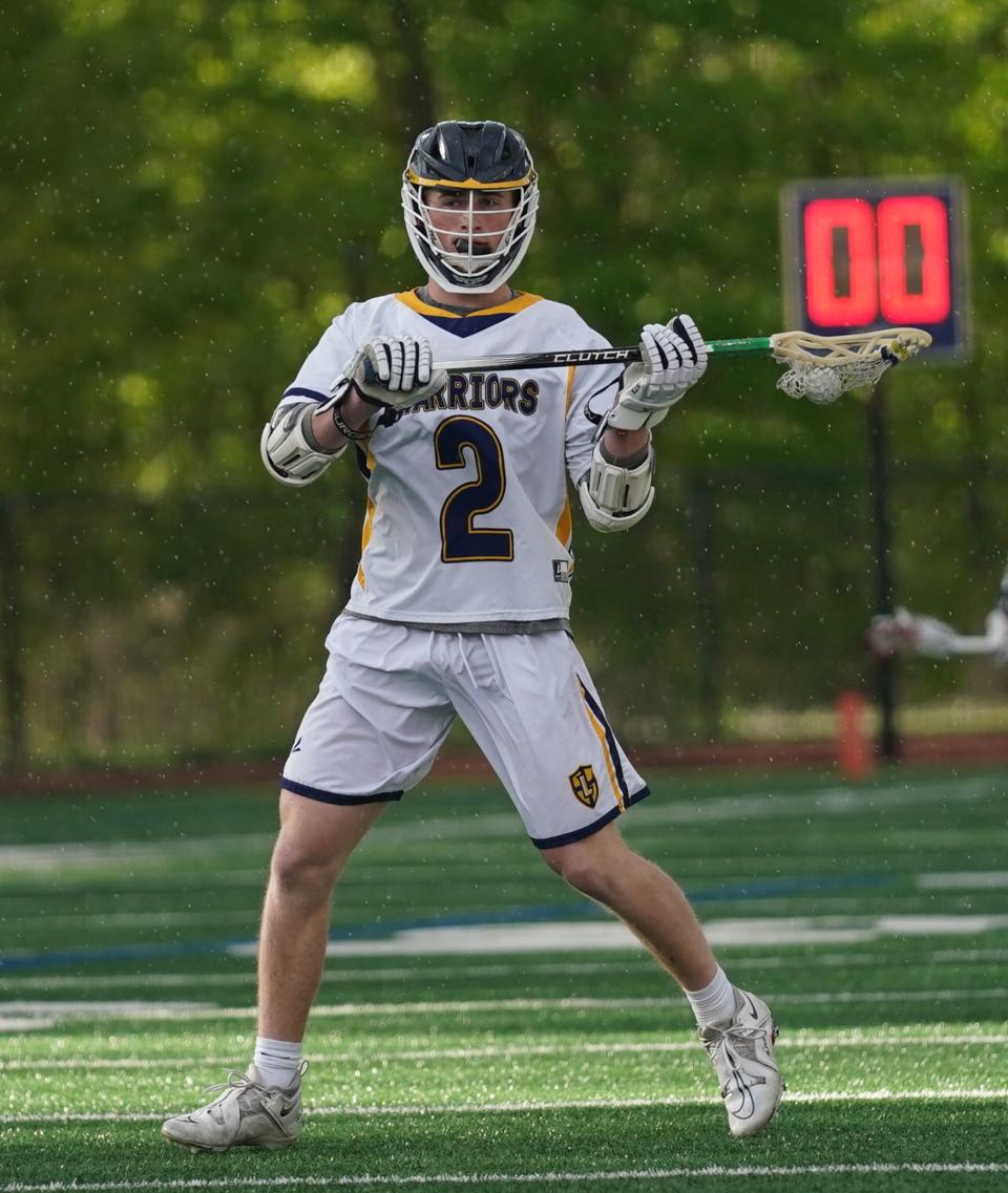 Lourdes' Matthew Krauza (4) looks for a pass during their 16-15 win over Goshen in boys lacrosse action Our Lady of Lourdes High School in Poughkeepsie on Friday.