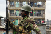 <p>Residents watch from their balconies as Kenyan security forces chase supporters of Kenyan opposition leader and presidential candidate Raila Odinga who demonstrate in the Mathare area of Nairobi Wednesday Aug. 9, 2017. Odinga alleges that hackers manipulated the Tuesday election results which appear to show President Uhuru Kenyatta has a wide lead over Odinga. (Photo: Jerome Delay/AP) </p>