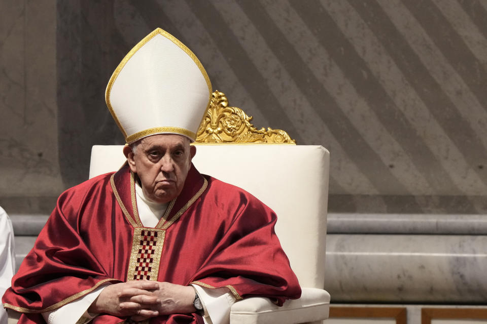 Pope Francis celebrates the Passion Mass on Good Friday, inside St. Peter's Basilica, at the Vatican, Friday, April 7, 2023. (AP Photo/Andrew Medichini)