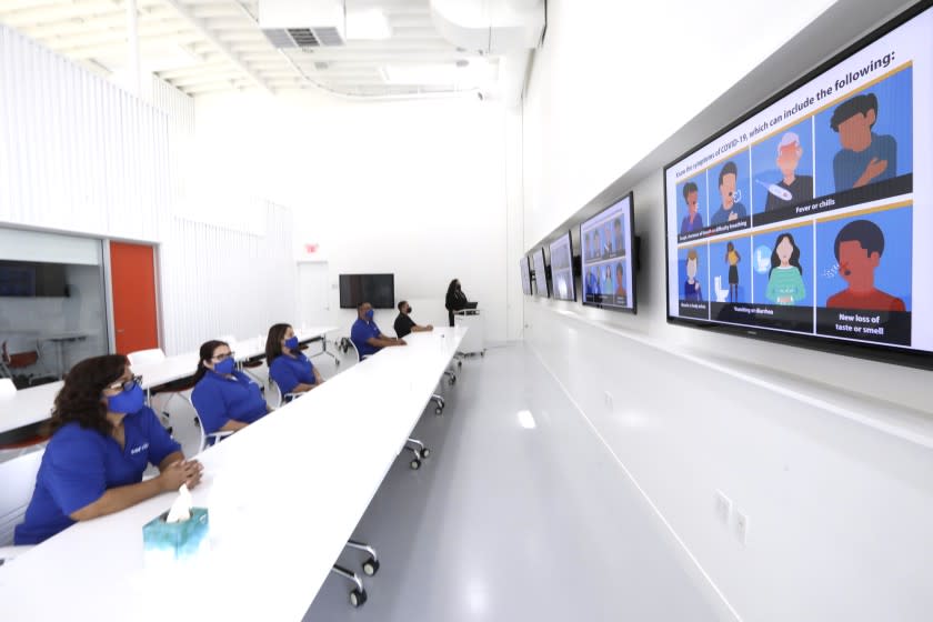 CULVER CITY - SEPTEMBER 16, 2021 - - Workers at Servicon, a janitorial and maintenance company, participate in a class in COVID-19 Safety Training and Policies and Procedures in The Learning Center of the company's training facility in Culver City on September 16, 2021. The company has a workforce of 2000 people and has seen its workforce grow by 400 during the pandemic, as hospitals and factories required more disinfectant services. (Genaro Molina / Los Angeles Times)