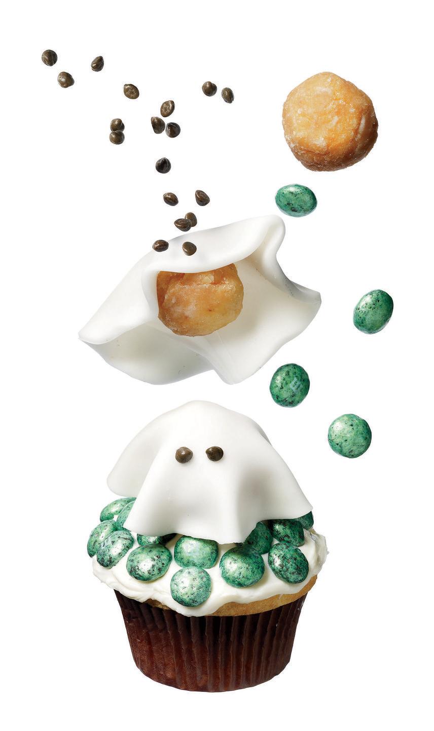 <p>Float a fondant-covered doughnut hole on a bed of vanilla frosting dotted with mint chocolate M&M's for the sweetest ghost we've ever seen.</p><p><em><a href="https://www.womansday.com/food-recipes/food-drinks/recipes/a11455/friendly-ghost-cupcake-recipe-122729/" rel="nofollow noopener" target="_blank" data-ylk="slk:Get the recipe from Woman's Day »;elm:context_link;itc:0;sec:content-canvas" class="link ">Get the recipe from Woman's Day »</a></em></p>