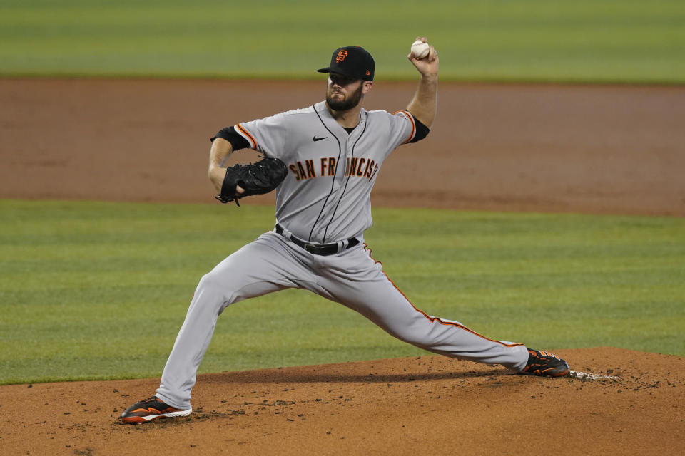 San Francisco starting pitcher Alex Wood throws a pitch during the first inning of a baseball game against the Miami Marlins, Sunday, April 18, 2021, in Miami. (AP Photo/Marta Lavandier)