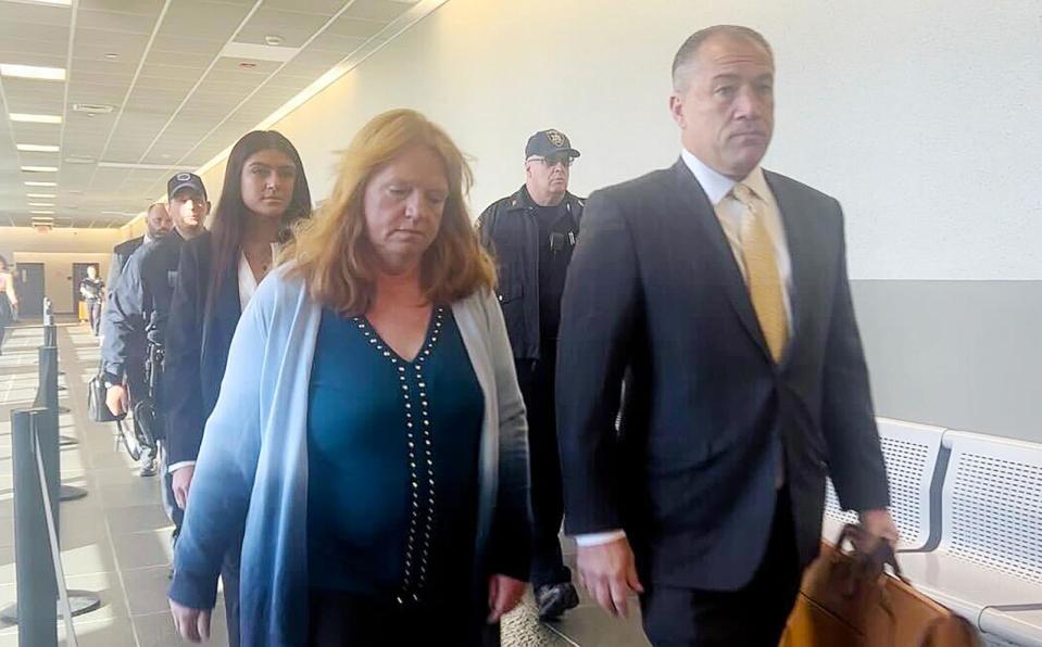 PHOTO: Asa Ellerup, wife of Gilgo Beach suspect Rex Heuerson, walks into the courtroom in Riverhead, New York with her lawyer, Bob Macedonio, Nov. 15, 2023.  (New York Daily News/Tribune News Service via Getty Images)