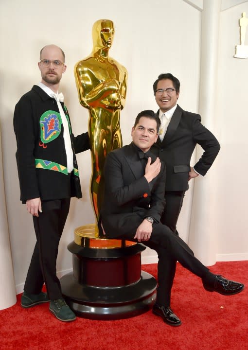 Daniel Scheinert, from left, Jonathan Wang and Daniel Kwan arrive at the Oscars on Sunday, March 10, 2024, at the Dolby Theatre in Los Angeles. (Photo by Richard Shotwell/Invision/AP)