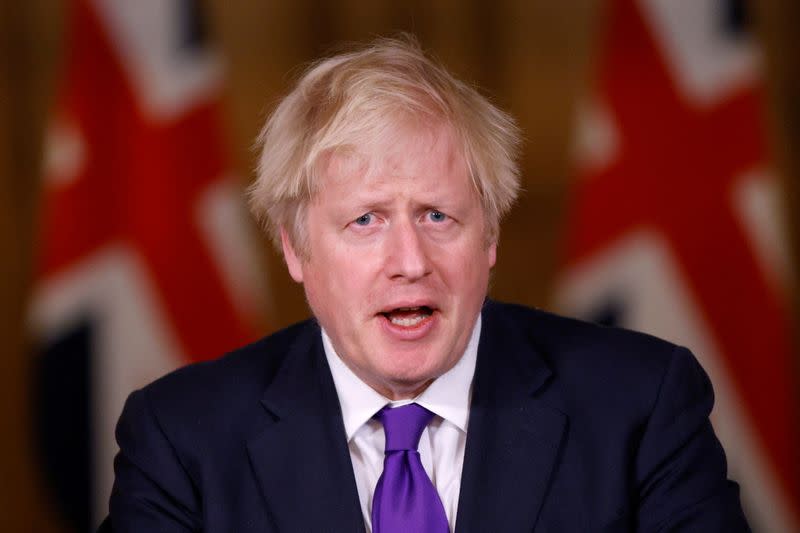 FILE PHOTO: Britain's PM Johnson attends a news conference in London