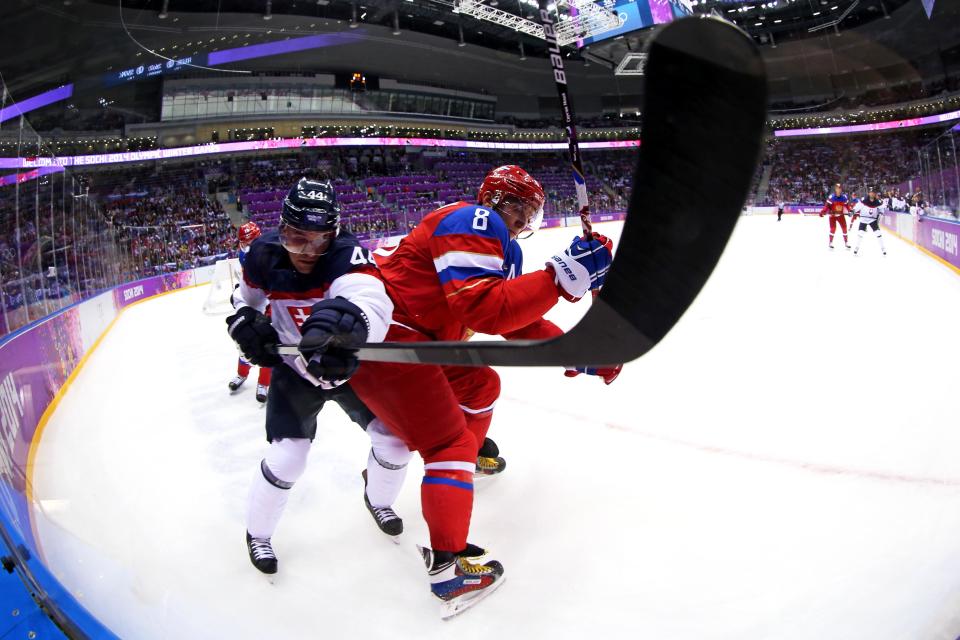 Andrej Sekera #44 of Slovakia checks Alexander Ovechkin #8 of Russia during the Men's Ice Hockey Preliminary Round Group A game on day nine of the Sochi 2014 Winter Olympics at Bolshoy Ice Dome on February 16, 2014 in Sochi, Russia.