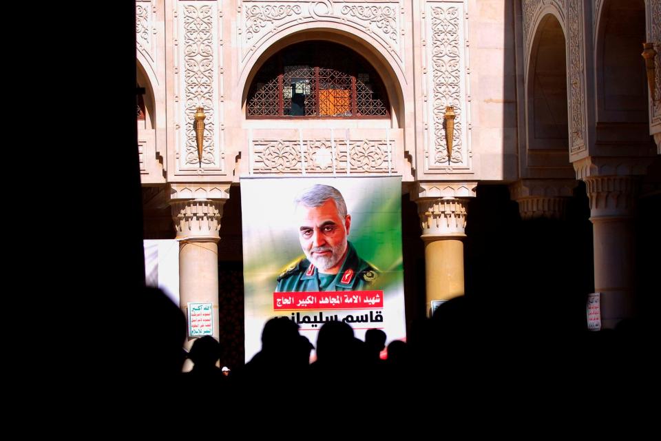 People attend a vigil for Qasem Soleimani in the Yemeni capital of Sanaa on Jan. 2, 2021, before the first anniversary of his killing by a U.S. drone strike.