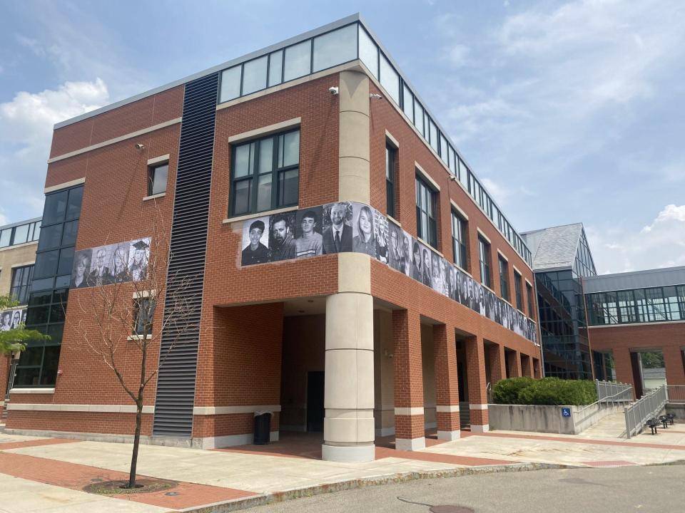 To Kick off its 20 anniversary the Alternative School for Math & Science installed an alumni photo of former students on the exterior of the school building