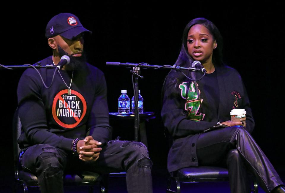 Activist Tamika Mallory, right, speaks during the symposium in Akron.