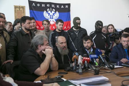 Members of the pro-Russian separatists government speaks during news conference in the regional government building in Donetsk, in eastern Ukraine April 18, 2014. REUTERS/Baz Ratner