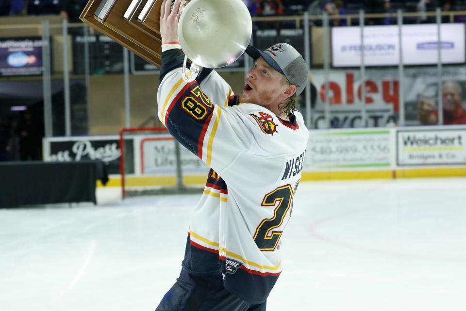 Peoria Rivermen and Chillicothe native Austin Wisely celebrates with the SPHL President's Cup after Peoria won the title with a Game 4 win over Roanoke at Berglund Center on May 3, 2022.