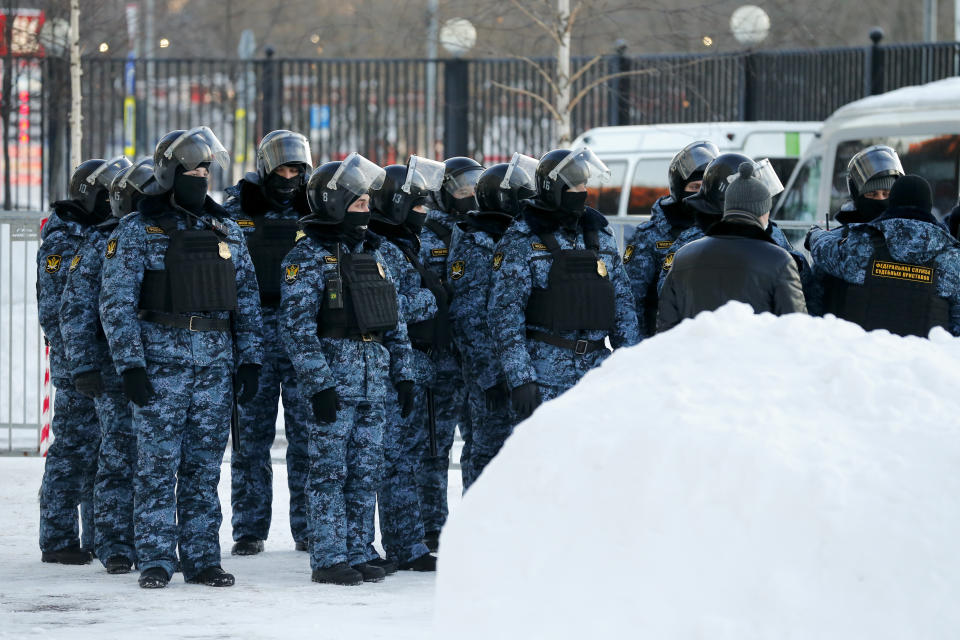 Russian Federal Bailiffs service officers stand during a briefing at the Babushkinsky district court prior to the start of a trial against Russian opposition leader Alexey Navalny in Moscow, Russia, on Tuesday, Feb. 16, 2021. Navalny is accused of defaming a World War II veteran who was featured in a video last year advertising constitutional amendments that allowed an extension of President Vladimir Putin's rule. (AP Photo/Alexander Zemlianichenko)