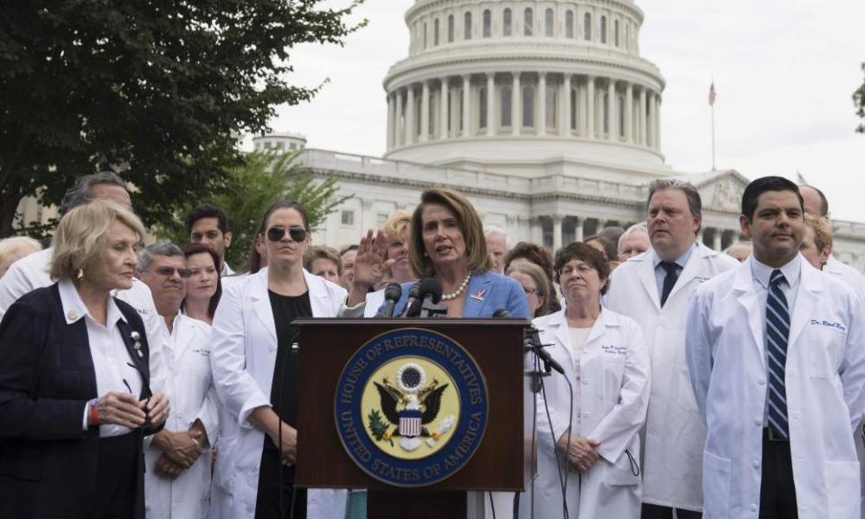 House Democratic leader Nancy Pelosi, of California, speaks alongside doctors, nurses and healthcare providers against the Republican bill.