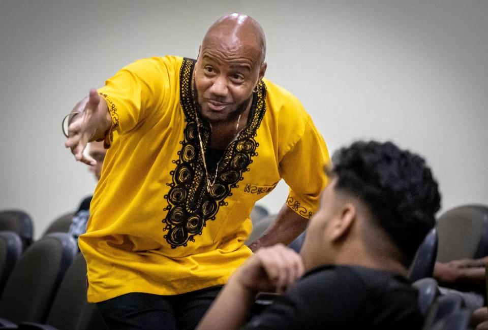 Professor Msomi Moor, left, as he teaches his African American studies class at Florida Memorial University.