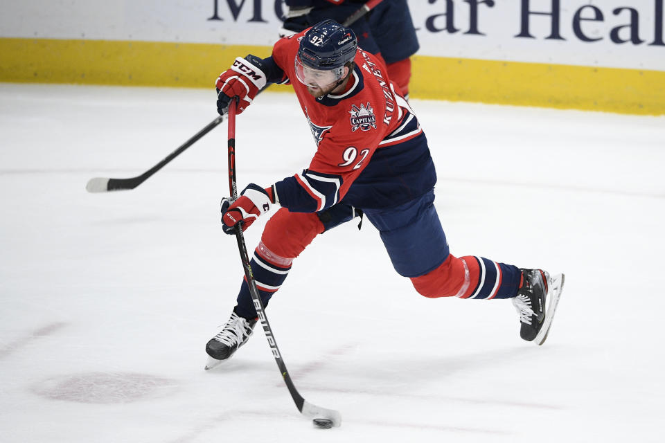 Washington Capitals center Evgeny Kuznetsov (92) shoots during the first period of the tema's NHL hockey game against the New Jersey Devils, Tuesday, March 9, 2021, in Washington. (AP Photo/Nick Wass)