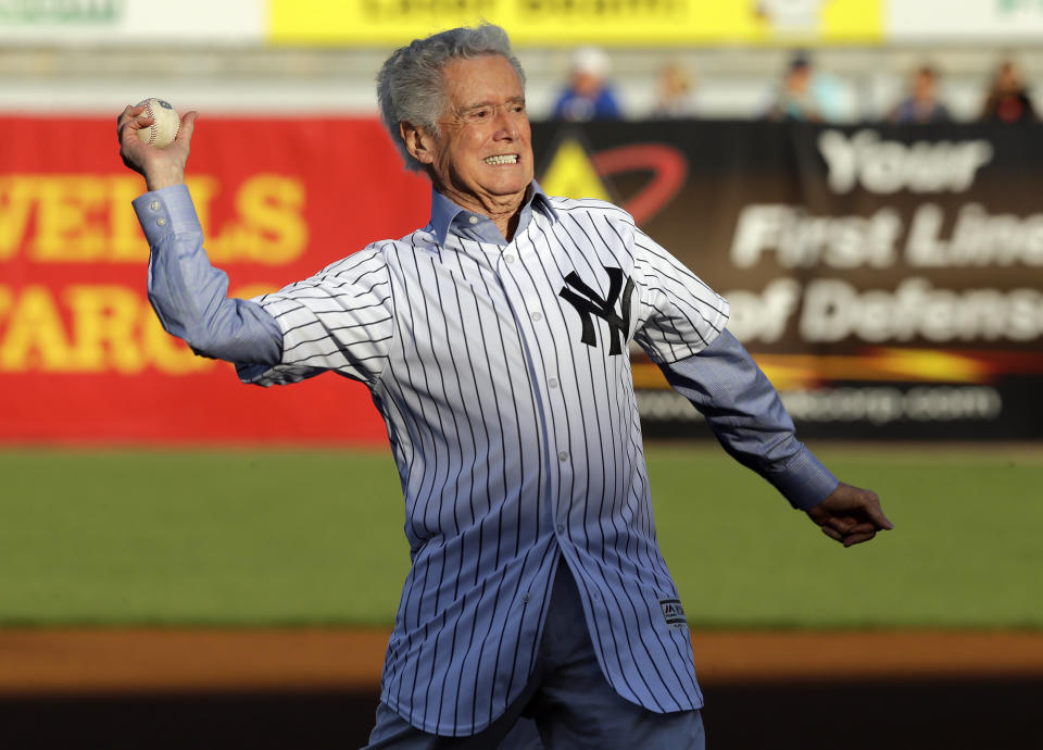 FILE - In this March 22, 2016 file photo,Regis Philibin throws out the ceremonial first pitch before a spring training baseball game between the New York Yankees and the New York Mets in Tampa, Fla. Philbin, the genial host who shared his life with television viewers over morning coffee for decades and helped himself and some fans strike it rich with the game show “Who Wants to Be a Millionaire,” has died on Friday, July 24, 2020. (AP Photo/Chris O'Meara, File)