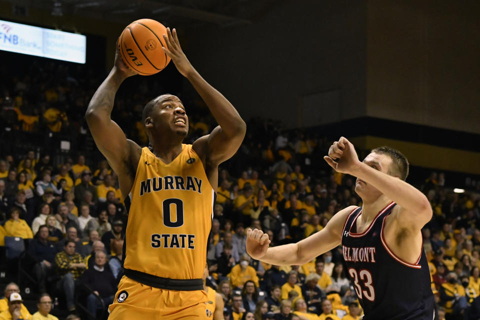 FILE -Murray State forward KJ Williams (0) shoots over Belmont center Nick Muszynski (33) during the second half of an NCAA college basketball game in Murray, Ky., Thursday, Feb. 24, 2022. Williams, the 6-10 forward followed coach Matt McMahon from Murray State to LSU after leading the Ohio Valley Conference in scoring (18.0 ppg) and ranked second in the league in rebounding (8.4) last season.(AP Photo/Timothy D. Easley, File)